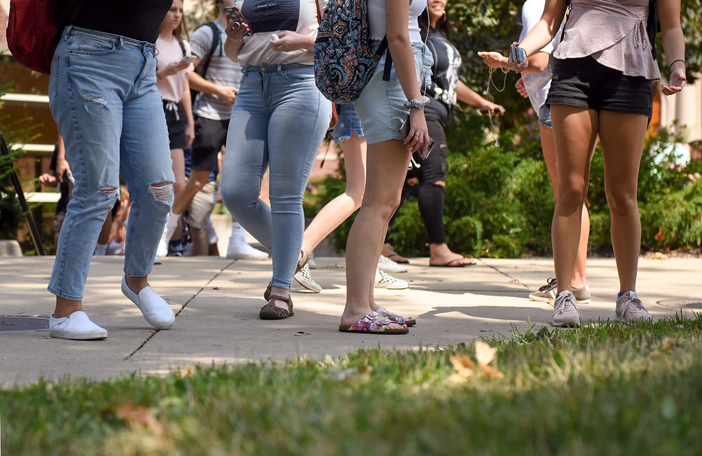 MU Students leave the Journalism School around noon on campus